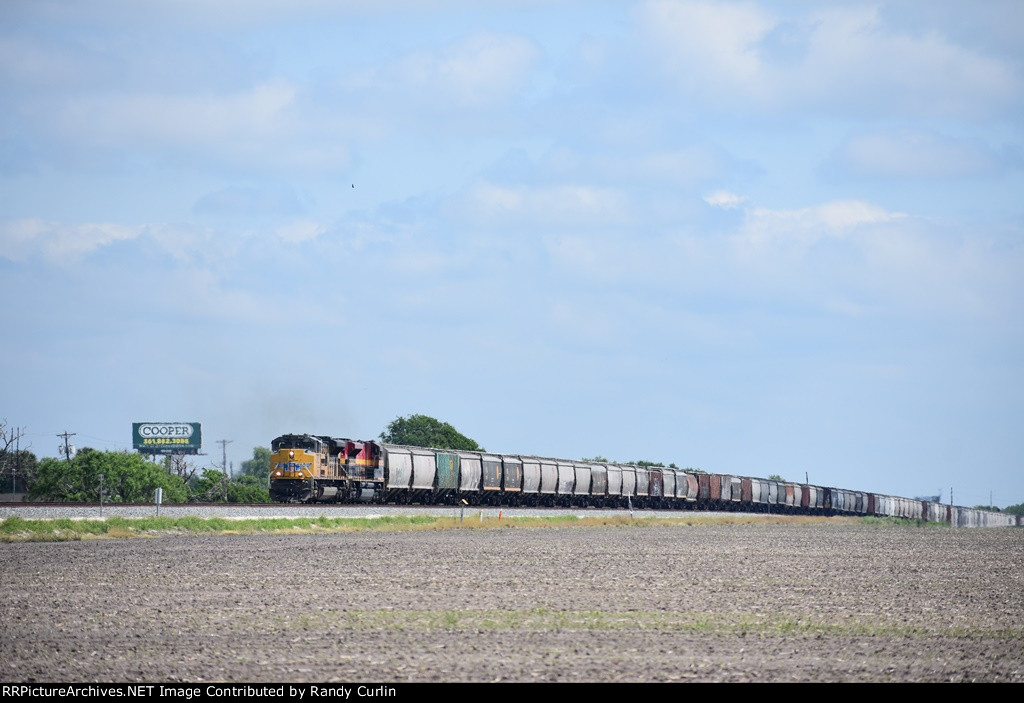 UP 8825 South on KCS grain train